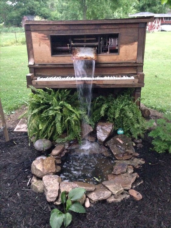 truly amazing to see miniature waterfalls emanating from pianos and umbrellas 5457 8