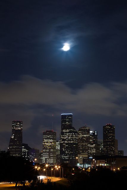 Capturing the enchanting magic of a moonrise over the Los Angeles skyline against the backdrop of Skyline Mountain.