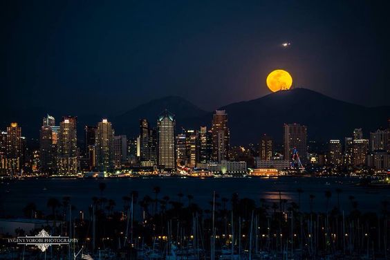 Capturing the enchanting magic of a moonrise over the Los Angeles skyline against the backdrop of Skyline Mountain.